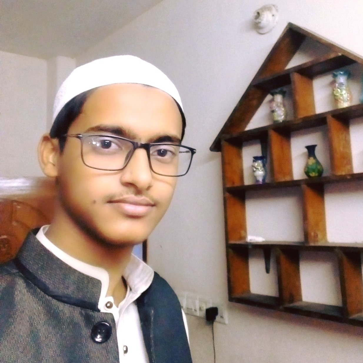 Headshot of Rifat